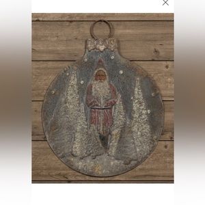 Ragon House snowy Santa metal wall hanging.